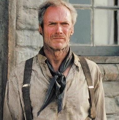 Clint Eastwood w dynamicznej pozie, uosabiający silnego i zdeterminowanego bohatera, charakterystycznego dla jego ról filmowych.